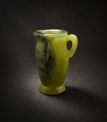 Hand-carved Dark Green jade Vessel features intricate carvings in the Persian/Mughal style. This 