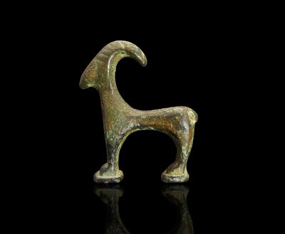 Ancient Luristan Bronze Goat, Near Eastern. This exquisite cast bronze figure depicts a goat, a 