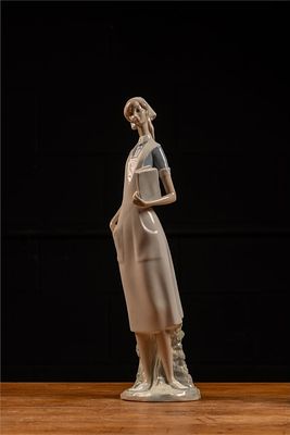 Lladró Porcelain Nurse Figurine, Spain. Item SKU: C-5617 This Lladró porcelain figurine depicts 