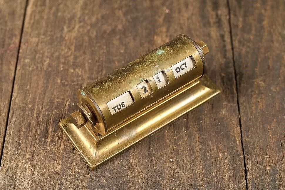Lot 262: Brass Desktop Perpetual Calendar