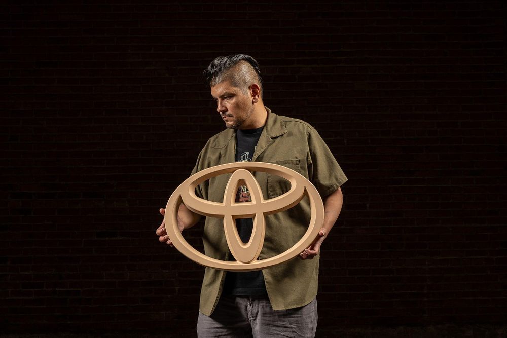 Lot 289: Plastic Toyota Logo Sign in Beige