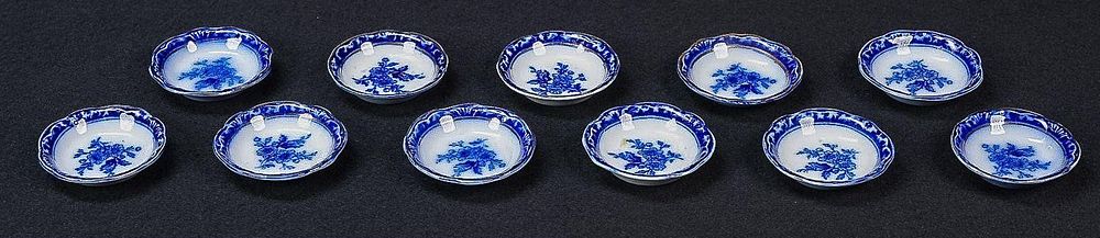 Lot 418: Set of Eleven Victorian Flow Blue Saucers