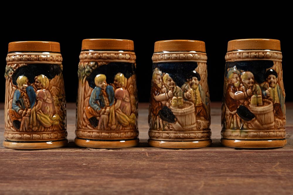 Lot 212: Set of 4 Hand Decorated German-Style Beer Steins