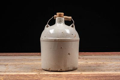 Bristol Glazed Stoneware Jug with Wire Handle. C-20795 Glazed stoneware jug with cylindrical 