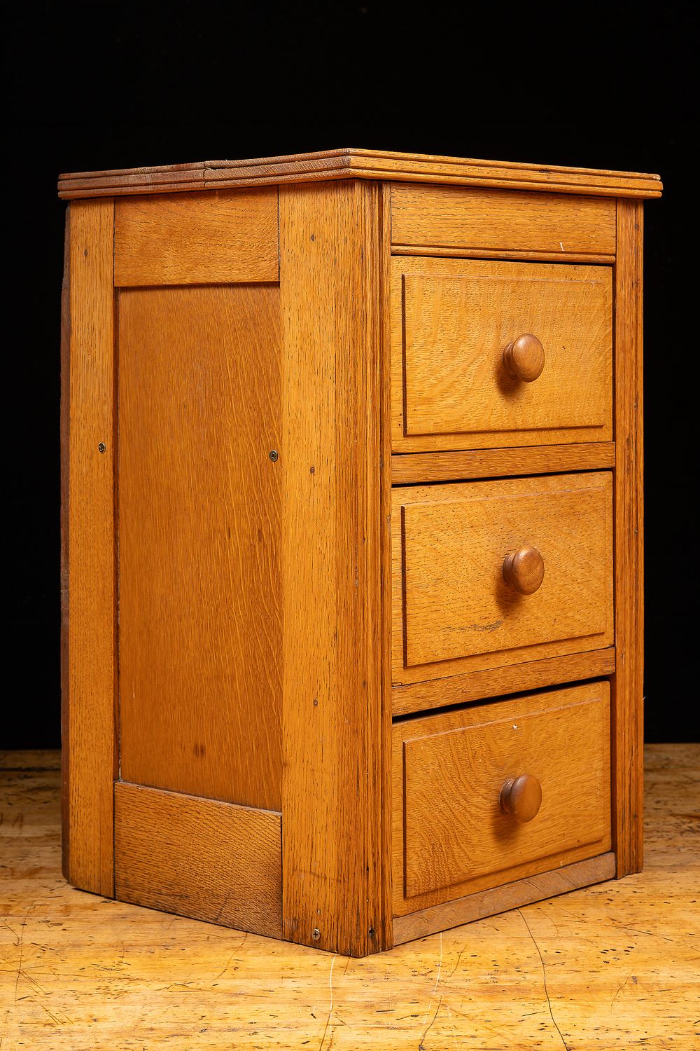 Lot 65: Three Drawer Piecemeal Oak Bedside Cabinet