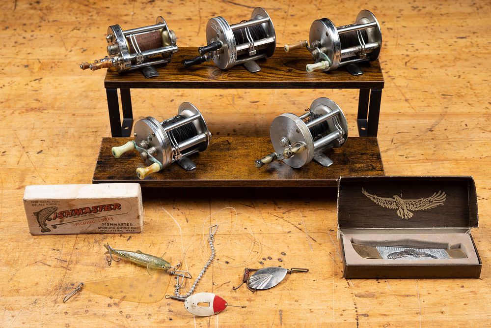 Lot 185: Lot of Five Baitcasting Reels, Lures, and Knife