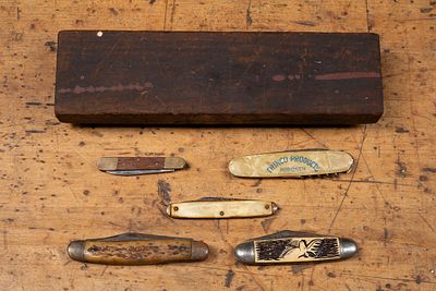 5 Pocket Knives and Sharpening Stone. C-22124 Group of five assorted folding pocket knives with 
