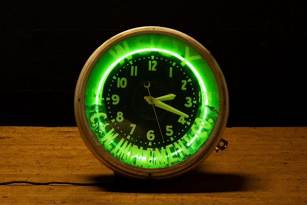 Lot 297: C W Implement Co Neon Advertising Clock