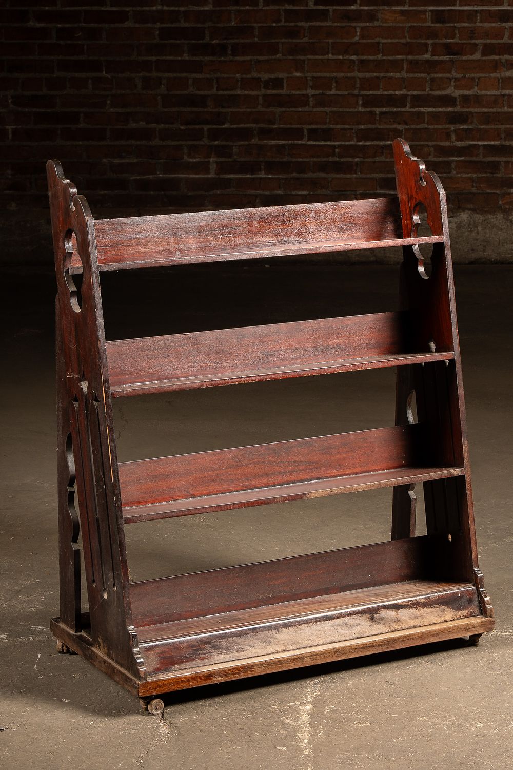Lot 338: Victorian Four Tier Rolling Display Shelf