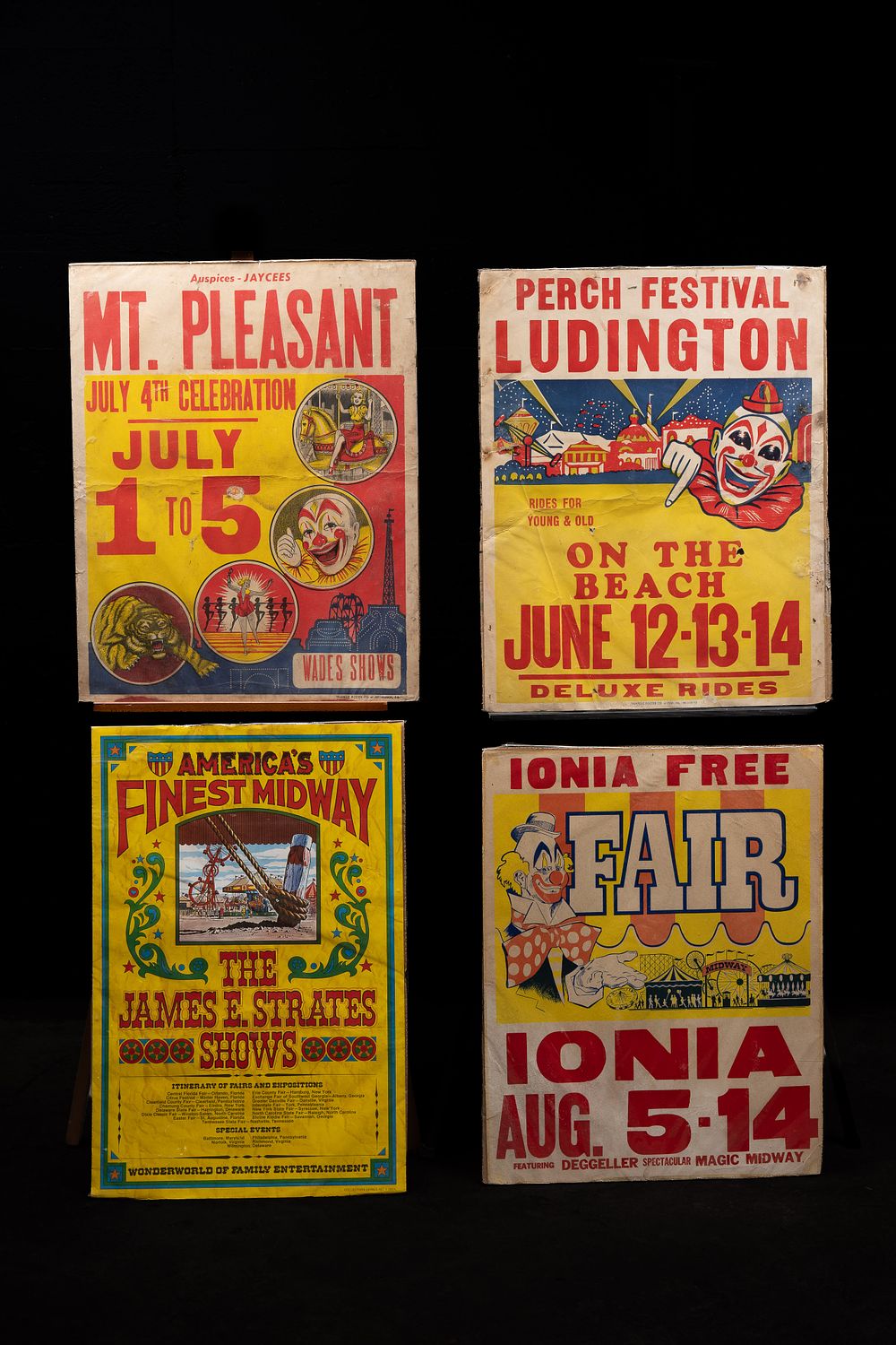 Lot 101: Four Mid-Century Carnival Window Posters