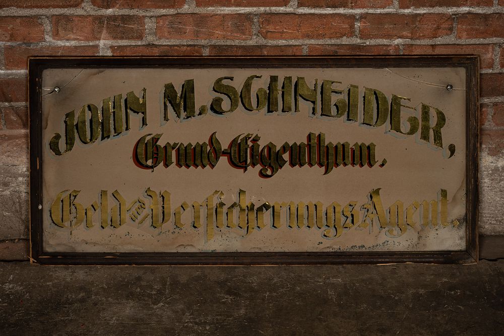 Lot 129: John M. Schneider German-American Glass Sign