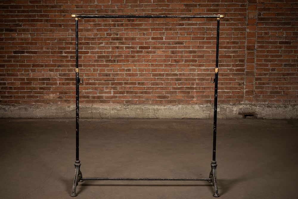 Lot 137: La Nueva Industria Cast Iron Clothing Rack