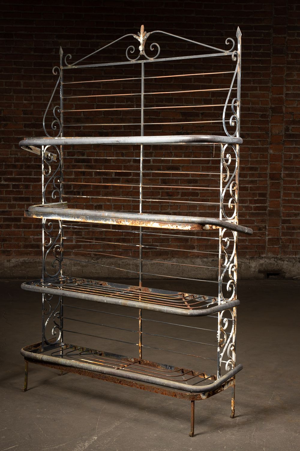 Lot 138: Ornate Wrought Iron Four-Tier Display Rack