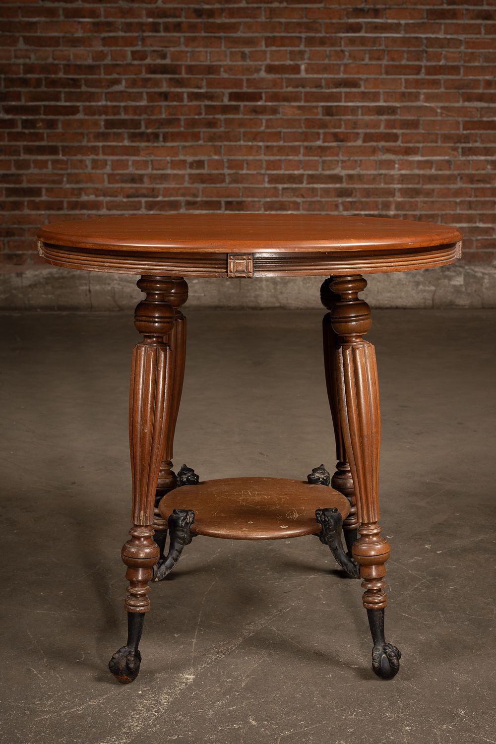 Lot 150: Round Table with Cast Iron Griffin Feet