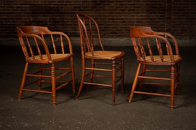 Three Cane Seat Spindle Back Chairs. C-22529 Three wood chairs comprising two spindle-back 