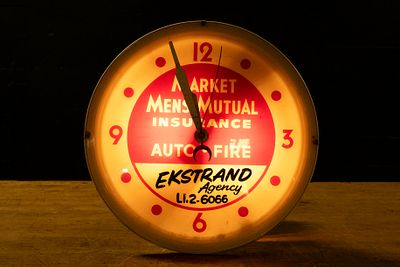 Ekstrand Agency Lighted Clock. C-22668 Market Mens Mutual Insurance lighted advertising clock 