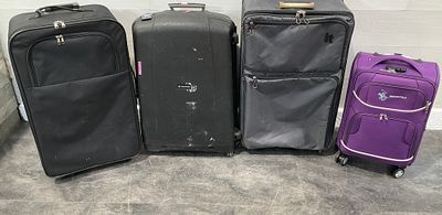 * A group of four suitcases including Samsonite, it luggage, and Swiss Polo examples. A set of 