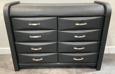 * A Contemporary Eight-Drawer Faux-Leather Upholstered Chest of Drawers in the Style of Global 