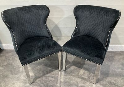 * A Pair of Contemporary Black Velvet Wingback Dining Chairs with Lion Head Knockers. A pair of 