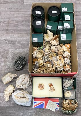 * A carton containing a large collection of Harmony Kingdom cast resin box figurines. A large 