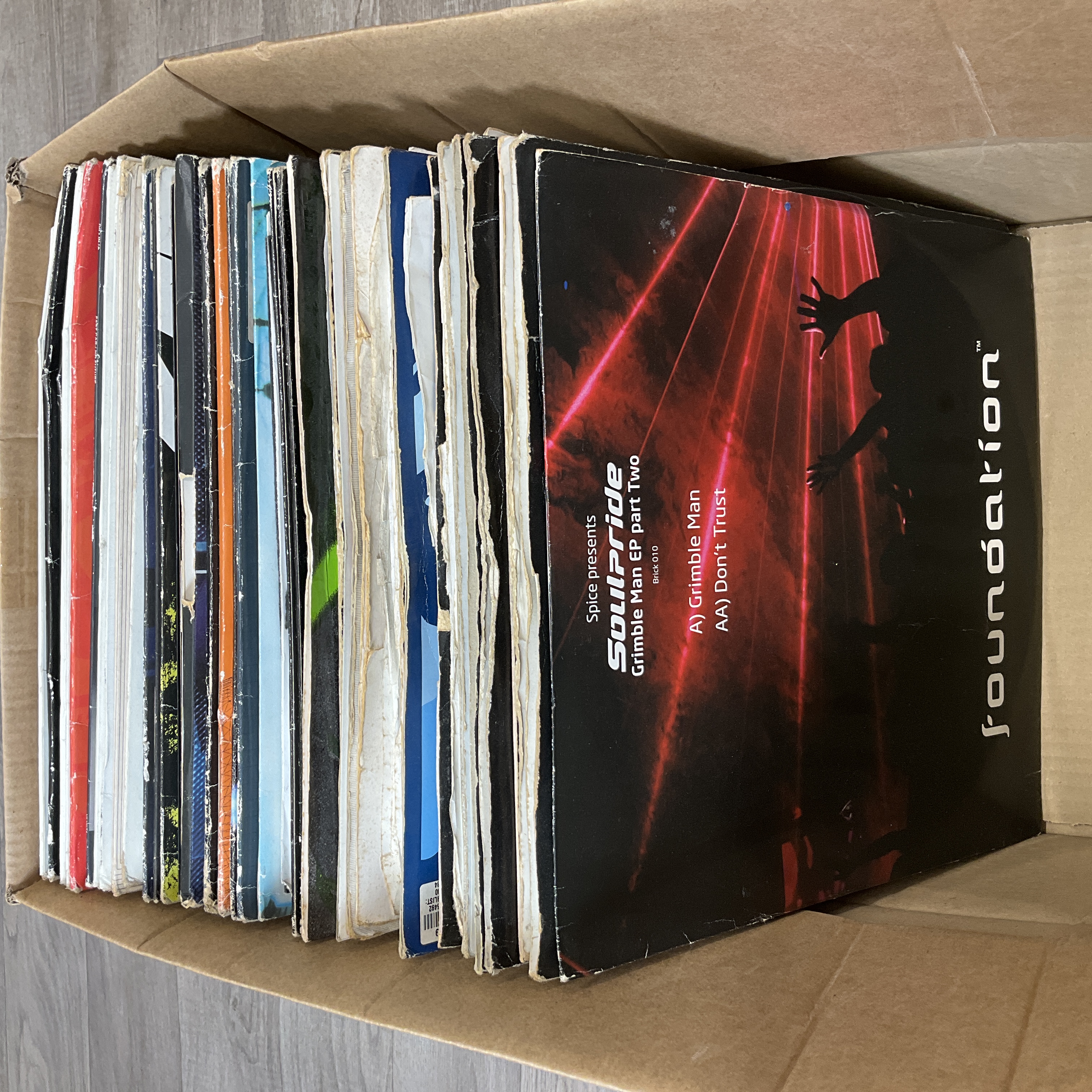* A carton containing a collection of Drum & Bass and Jungle 12-inch vinyl records