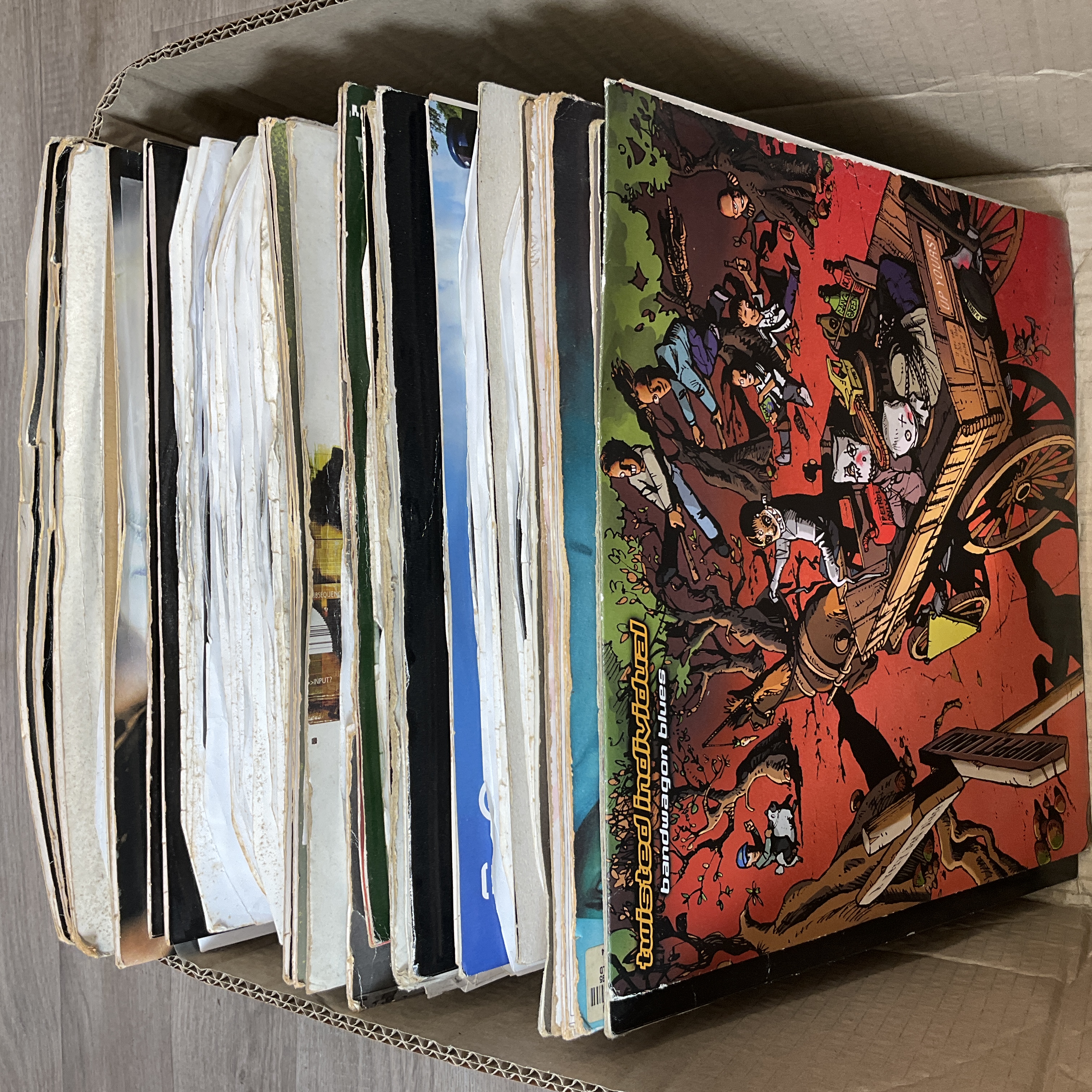 * A carton containing assorted Drum and Bass and Jungle 12 inch vinyl records and DJ promotional pressings