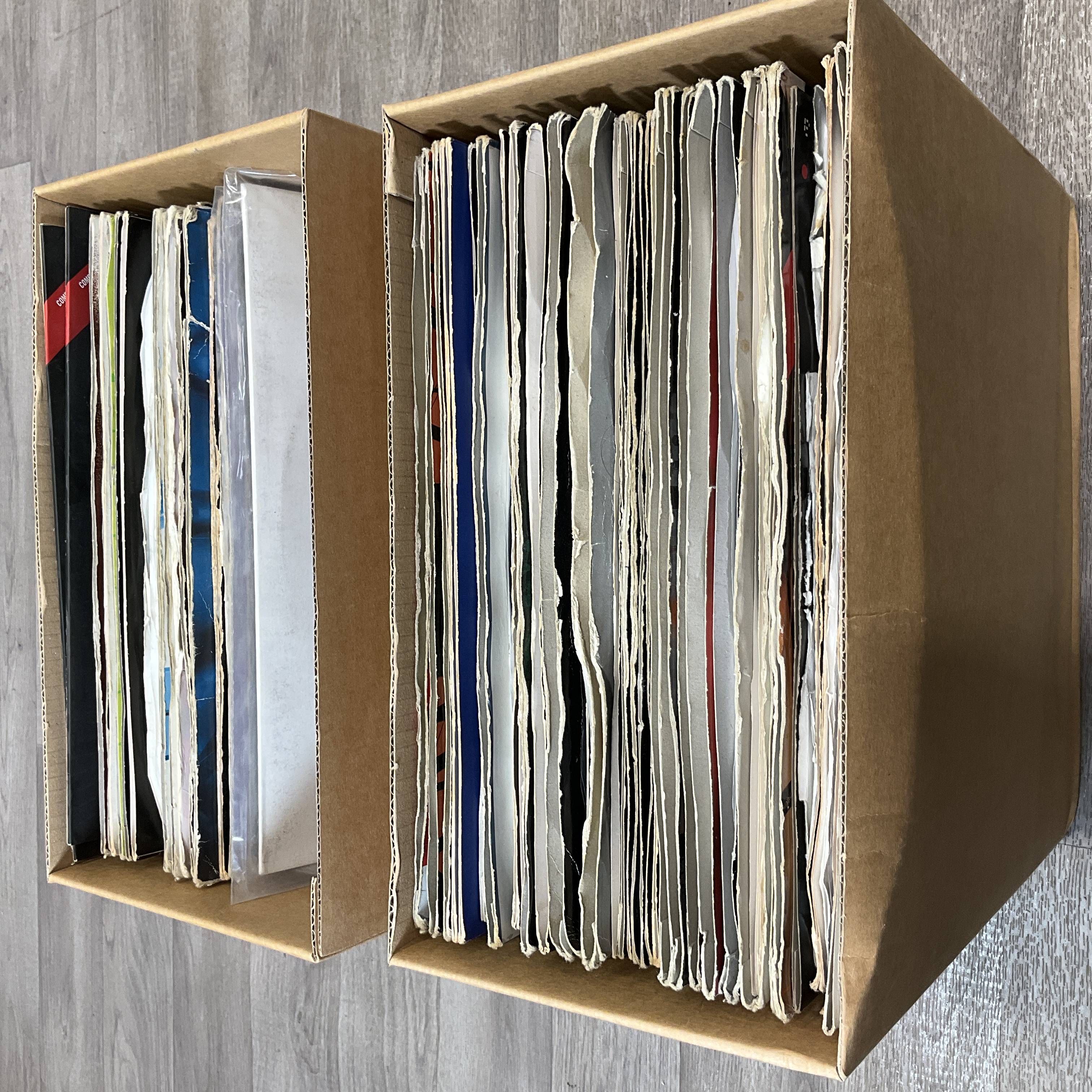* Two cartons containing a collection of Drum and Bass and Jungle 12 inch vinyl singles