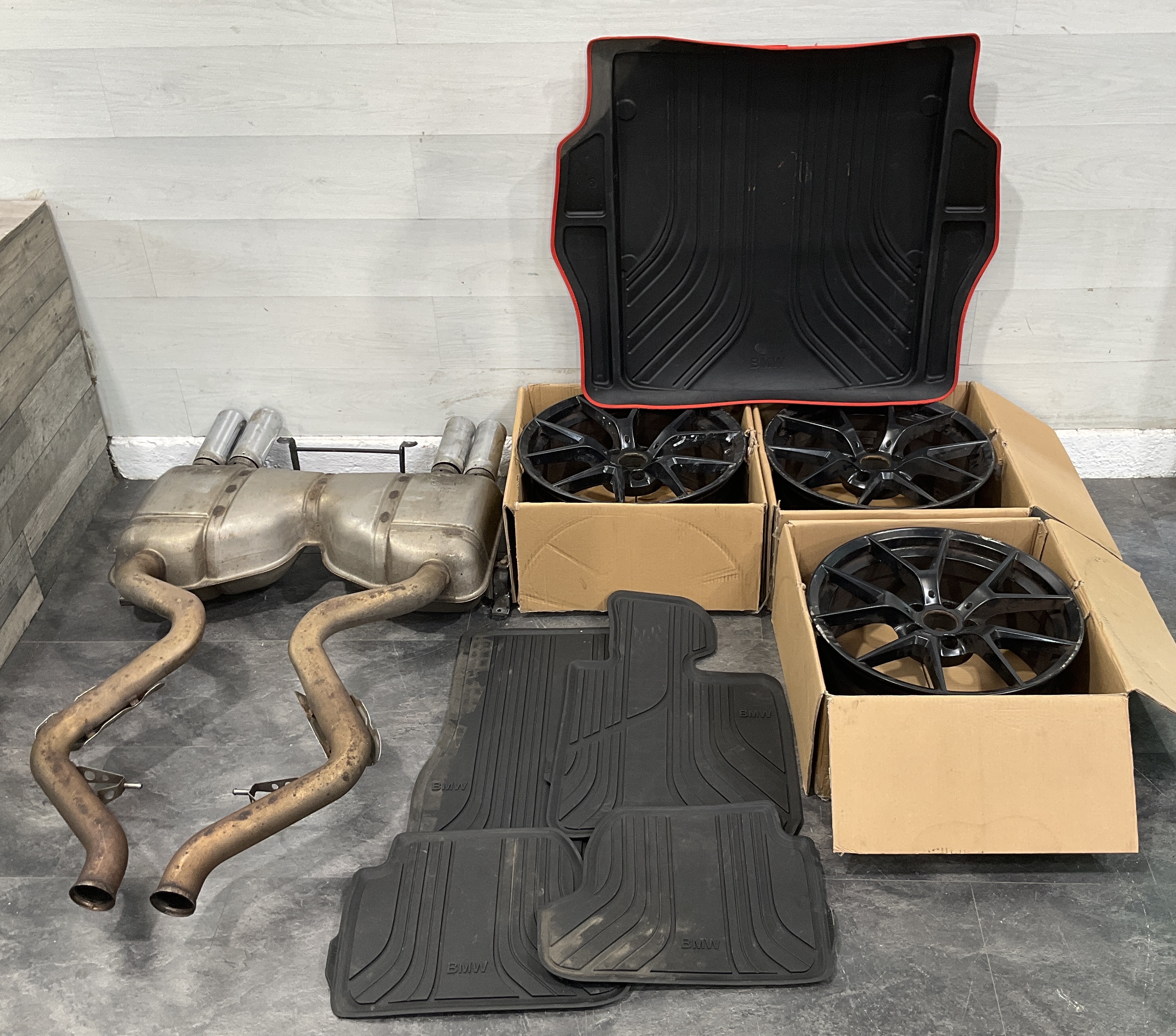 * A Collection of Genuine BMW F20 F21 F22 and F23 M-Performance Accessories including 19 Inch Alloy Wheels and Exhaust Silencer