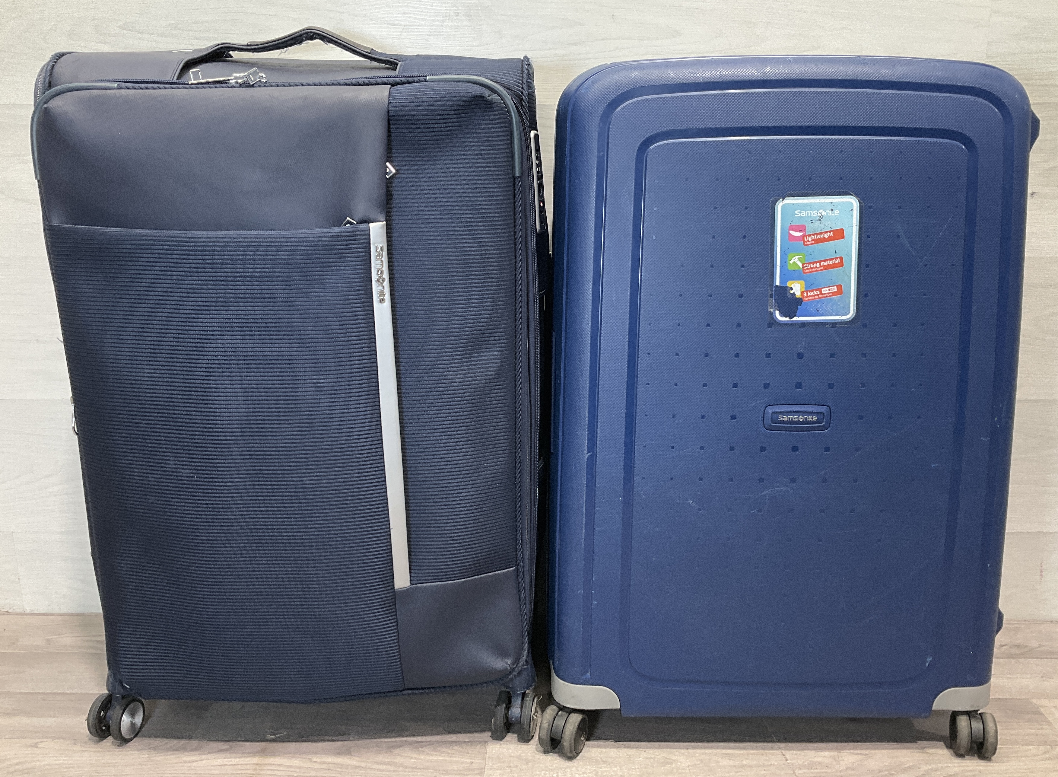 * A Pair of Samsonite Large Spinner Suitcases comprising S'Cure Hardside and Softside Models