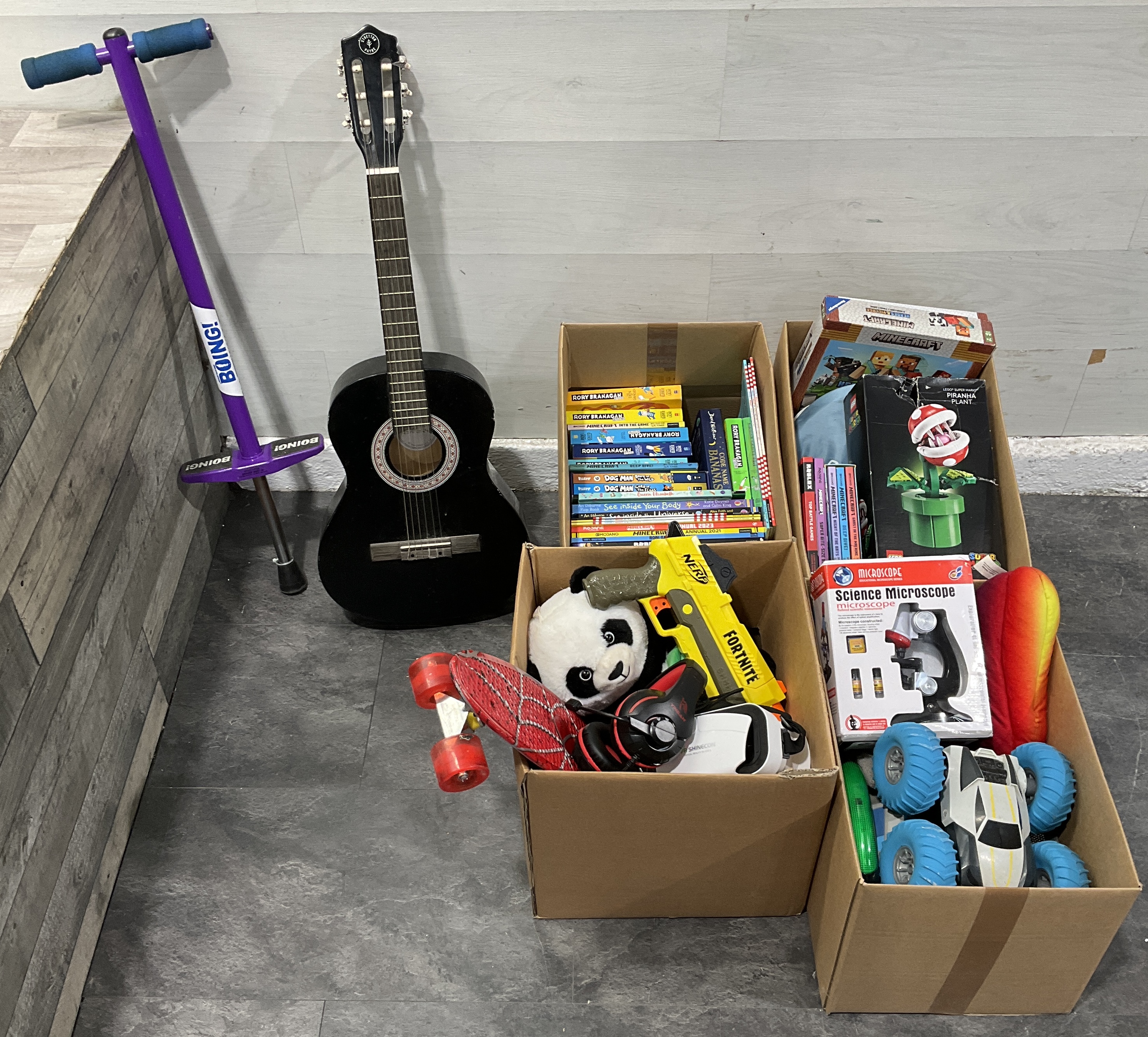 * A Collection of Children's Toys, Games, Books, and Musical Equipment across Four Cartons