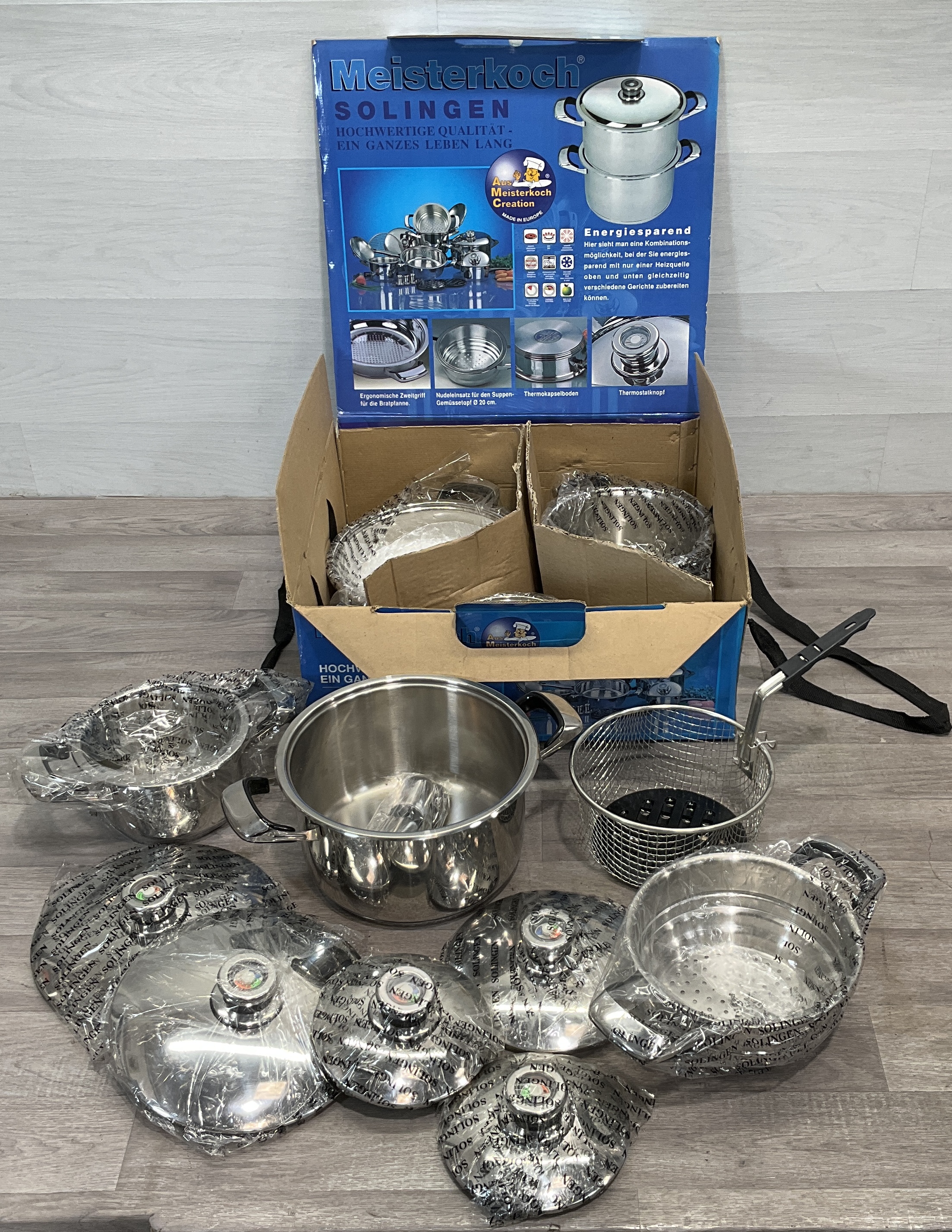 * A Set of Meisterkoch Solingen Stainless Steel Cookware