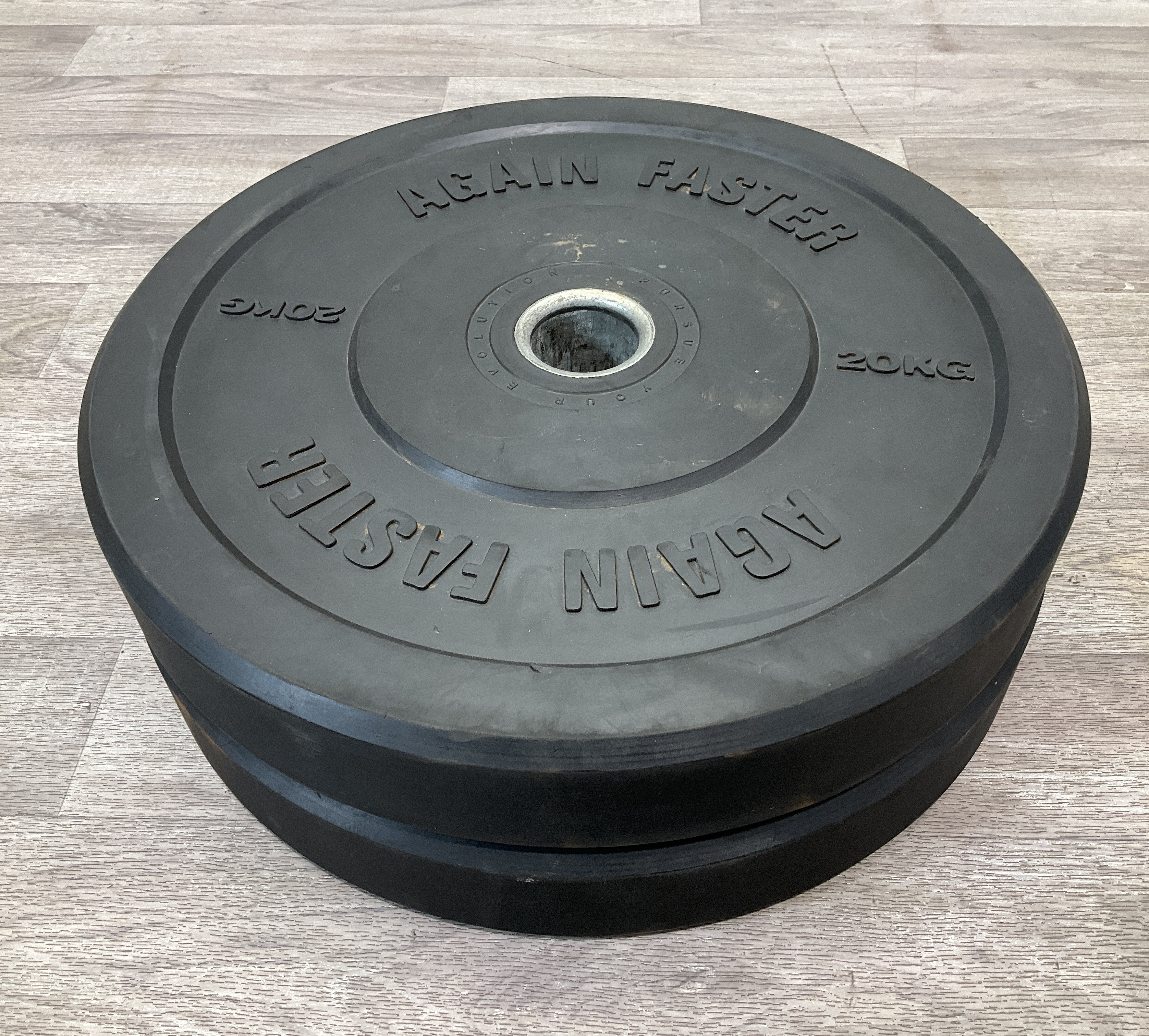 * A Pair of Again Faster Evolution Series 20kg Rubber Bumper Weight Plates