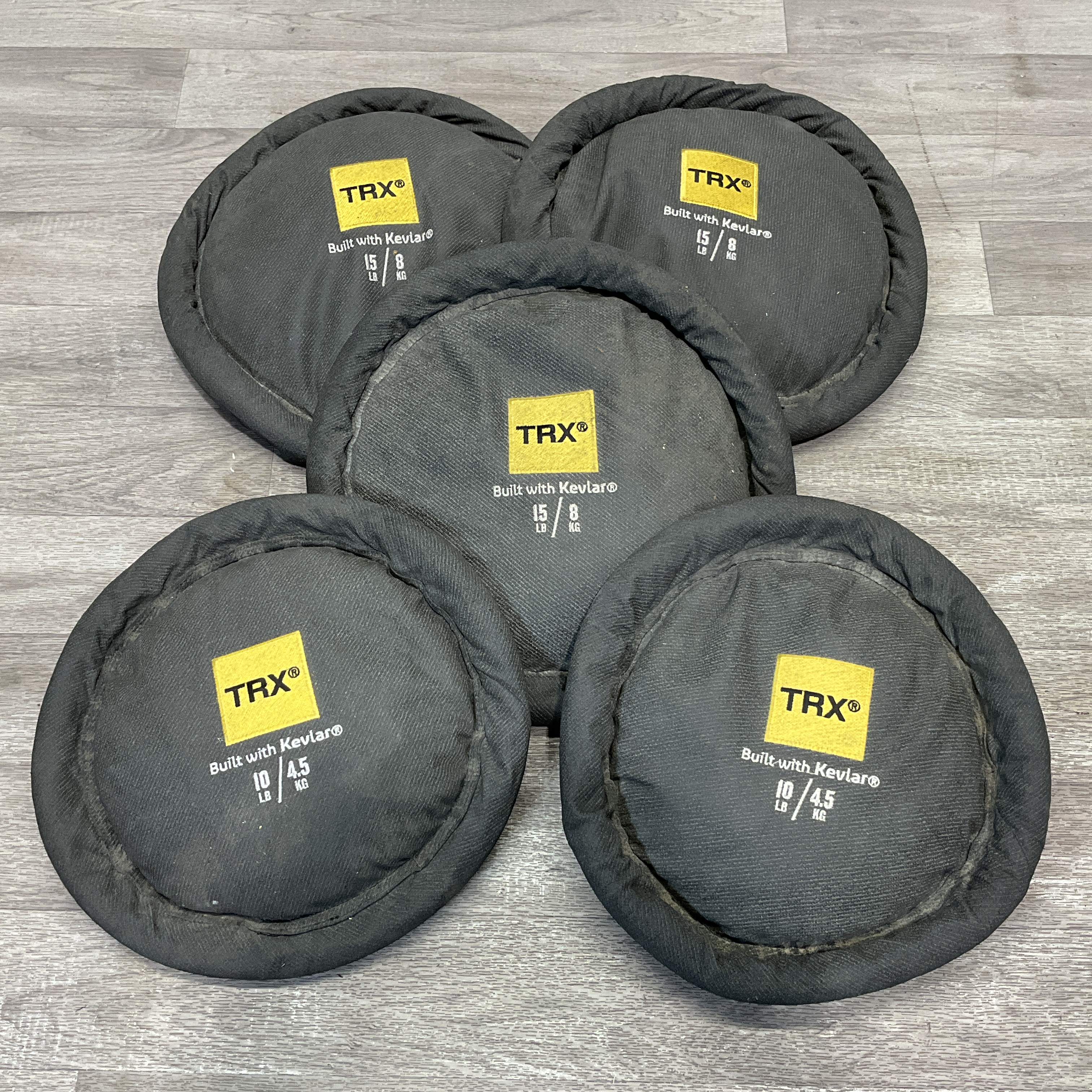 * A Set of Five TRX XD Kevlar Weighted Sand Discs