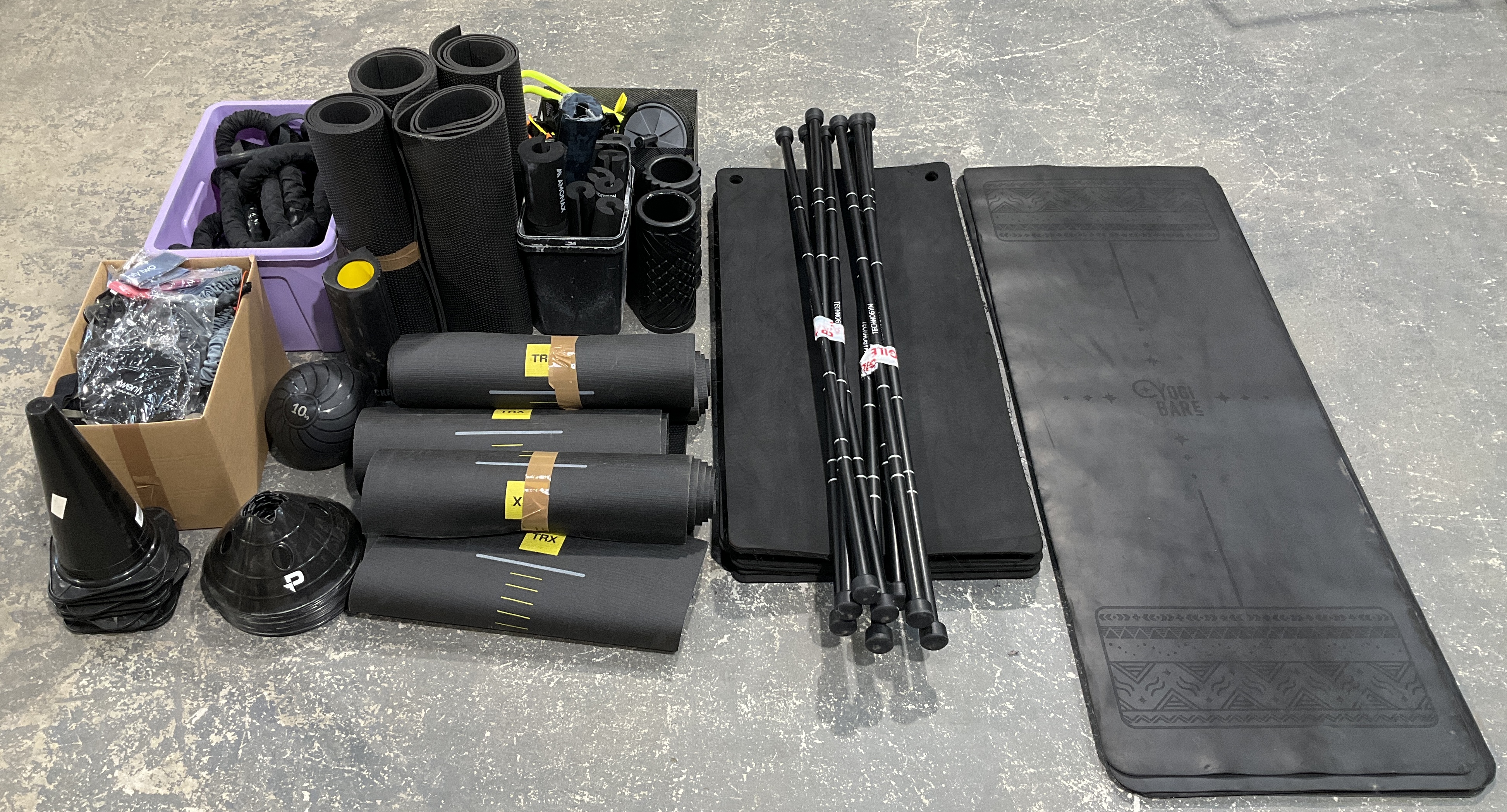 * A Collection of Professional Gym and Fitness Equipment including Technogym, TRX, and Yogi Bare
