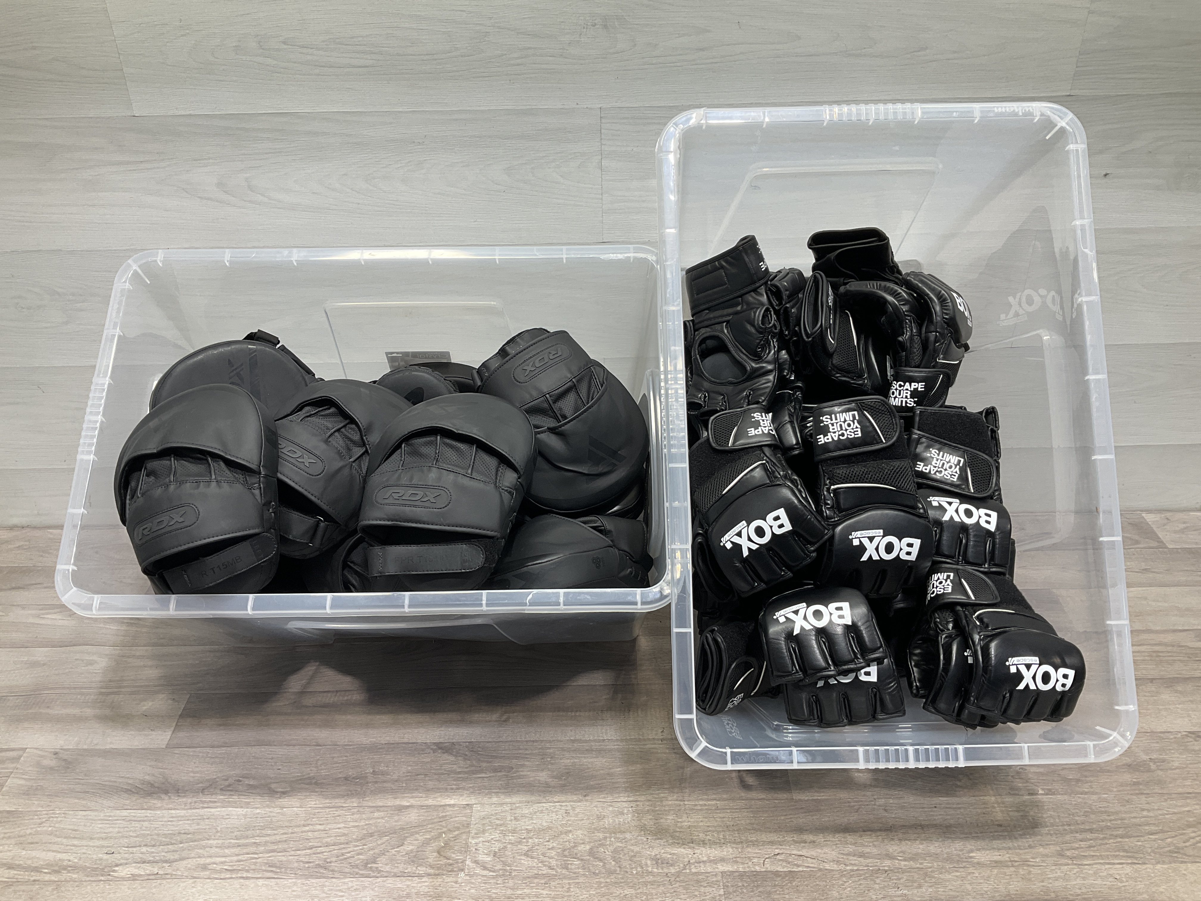 * 2 crates containing a collection of RDX curved focus mitts and Escape Fitness BOX MMA training gloves