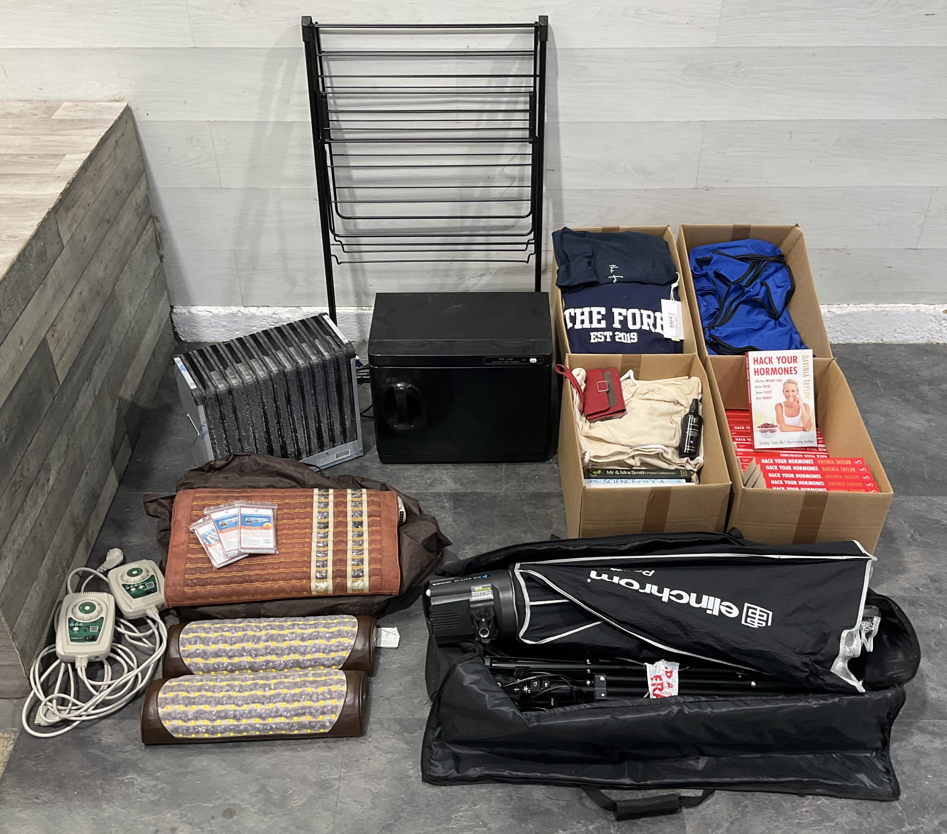 * An Assortment of Wellness Equipment, Elinchrom Photography Gear, Apparel, and Books including 4 Cartons