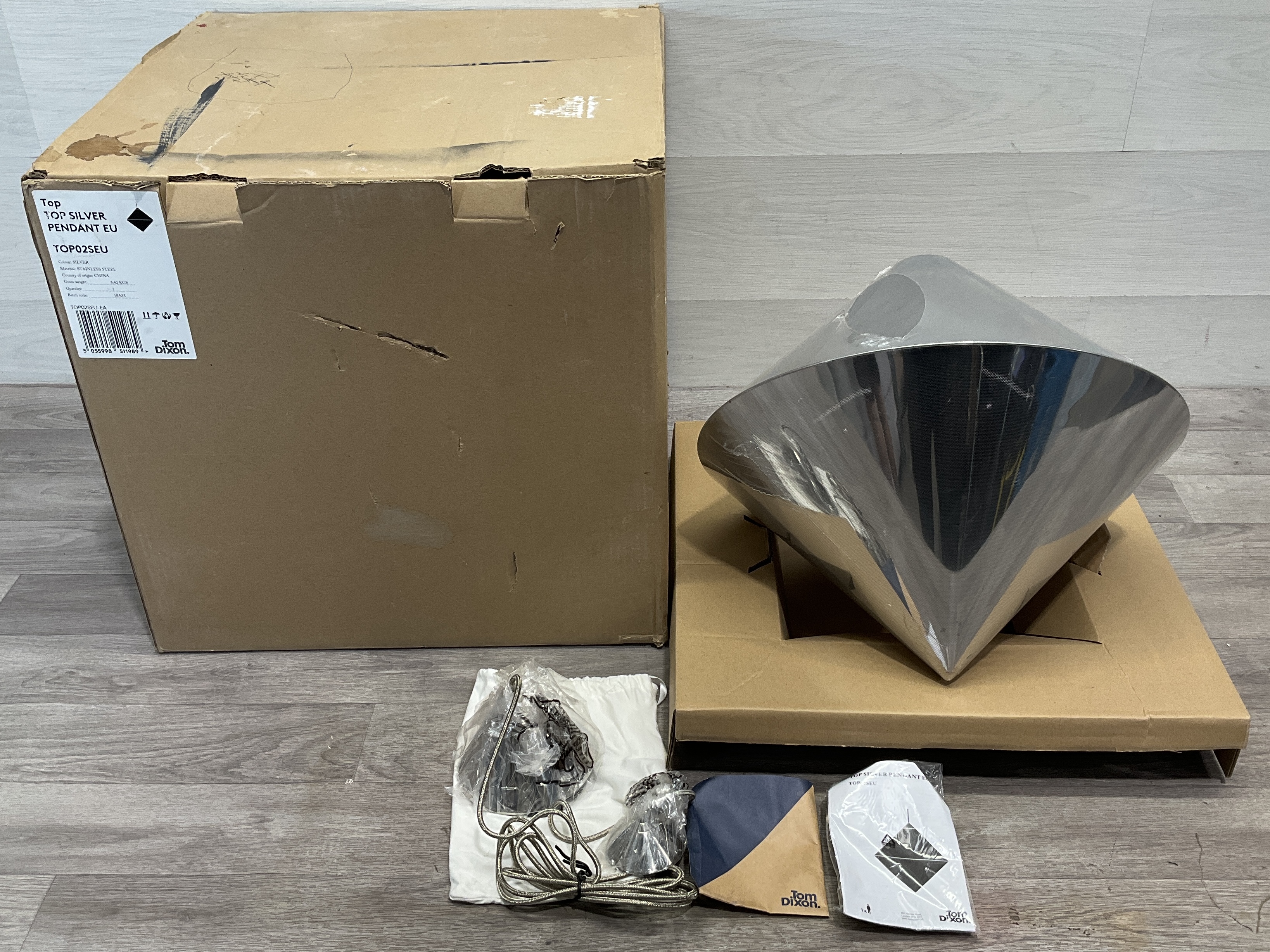 * A Tom Dixon Top Silver Pendant Light