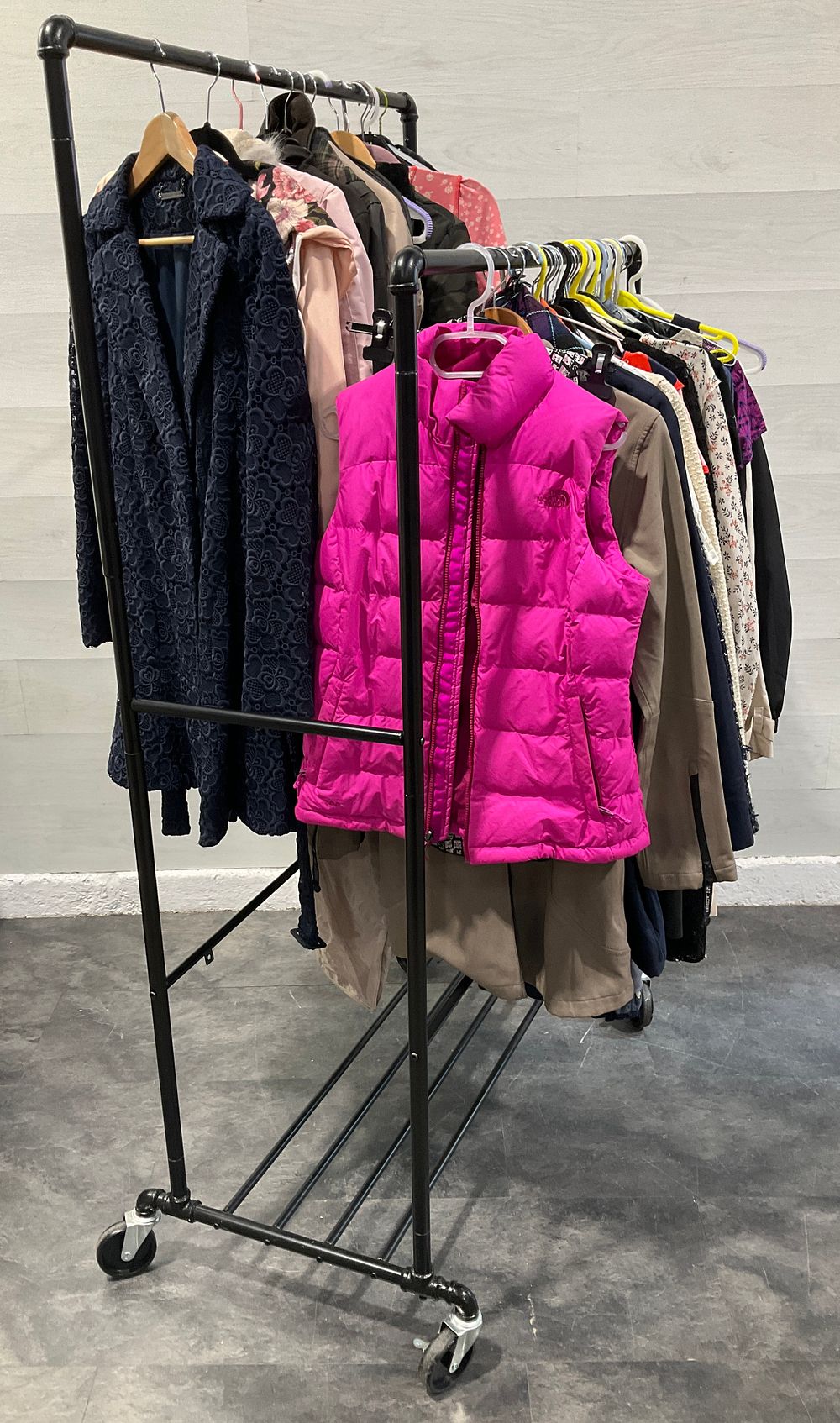 Lot 60: * A Clothes Rail Containing An Assortment of Assorted Clothing including The North Face and Columbia
