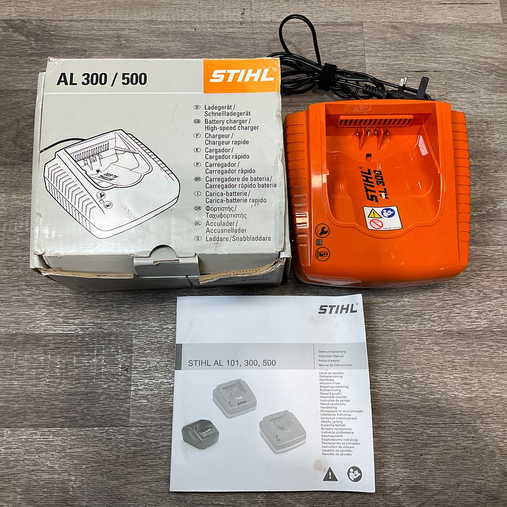 Lot 83: * STIHL AL 300 Rapid Battery Charger with Original Packaging and Manual