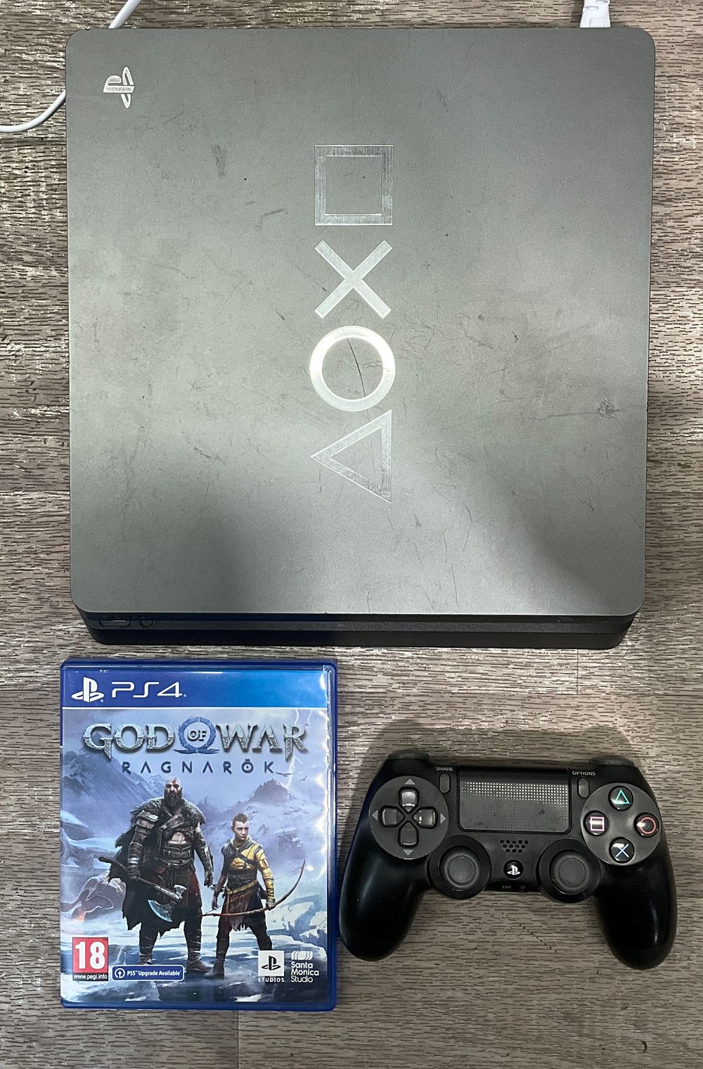 Lot 86: * Sony PlayStation 4 Model CUH-2216B Console with DualShock 4 Controller and God of War Ragnarok