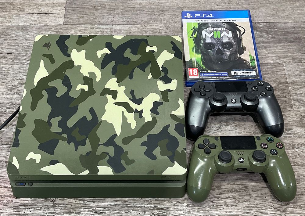 Lot 87: * Sony PlayStation 4 Model CUH-2116B Console with DualShock 4 Controllers and Call of Duty Modern Warfare II
