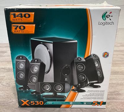 * A Boxed Logitech X-530 5.1 Surround Sound Speaker System. A carton containing a Logitech X-530 