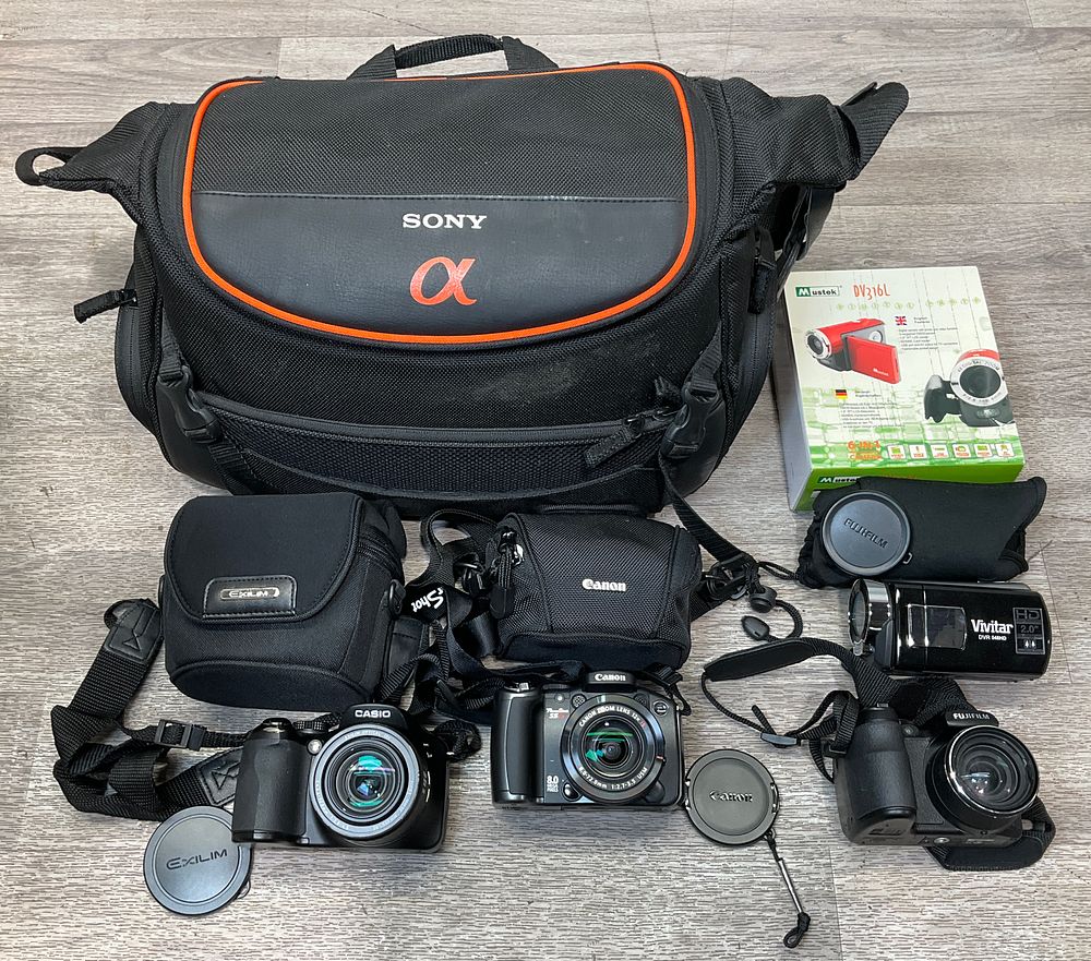 Lot 146: * A Sony Alpha System Carrying Case Containing An Assortment of Digital Bridge Cameras and Camcorders including Canon PowerShot S5 IS