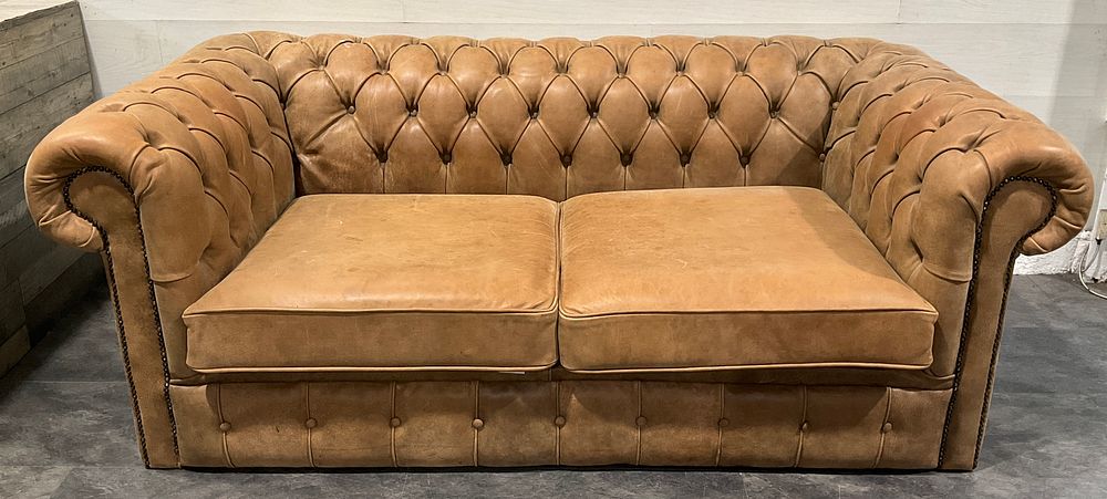 Lot 15: * A Tan Leather Two Seater Chesterfield Sofa