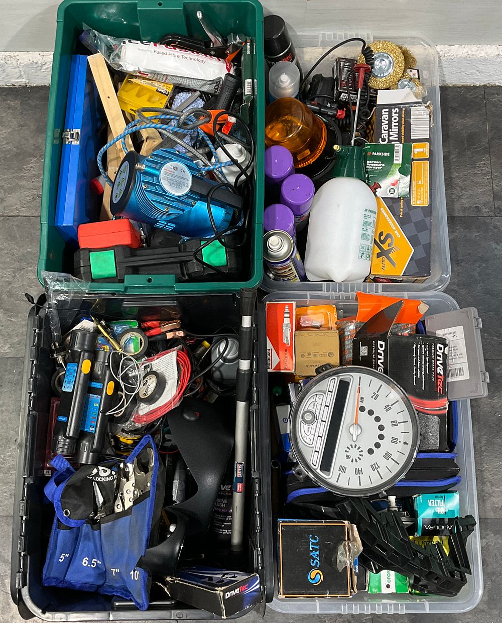 Lot 57: * 4 Crates Containing An Assortment of Household Goods and Automotive Accessories including Mini Cooper Instrument Cluster and DriveTec Brake Pads