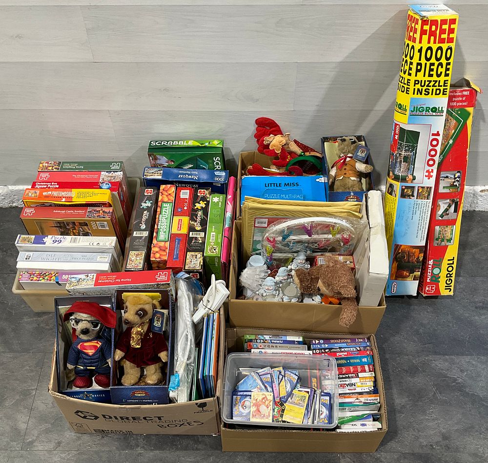 Lot 86: * 6 Cartons Containing An Assortment of Household Goods including Jigsaw Puzzles, Meerkat Plush Toys & Pokémon Trading Cards
