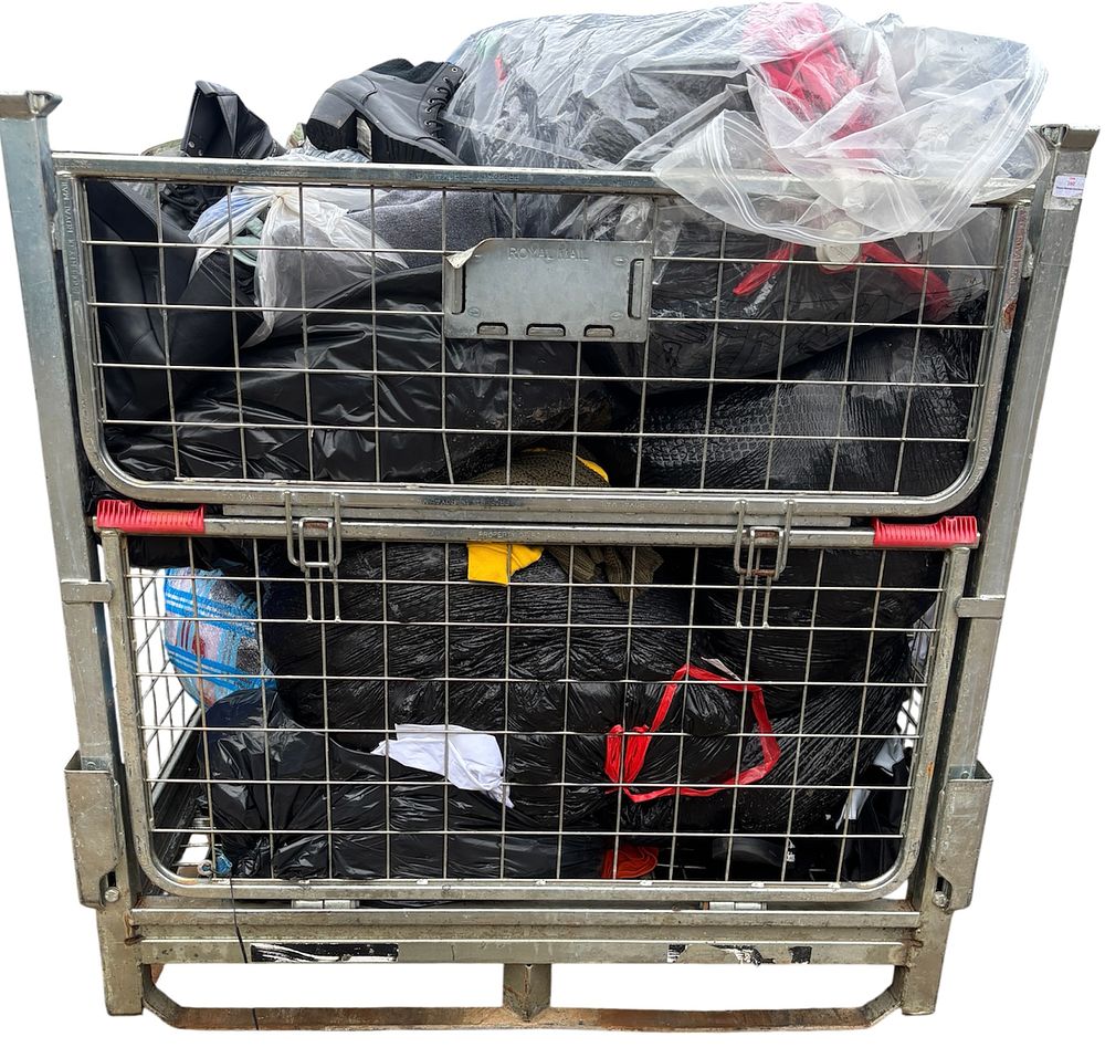 Lot 99: * A cage containing assorted clothing and footwear - CAGE NOT INCLUDED