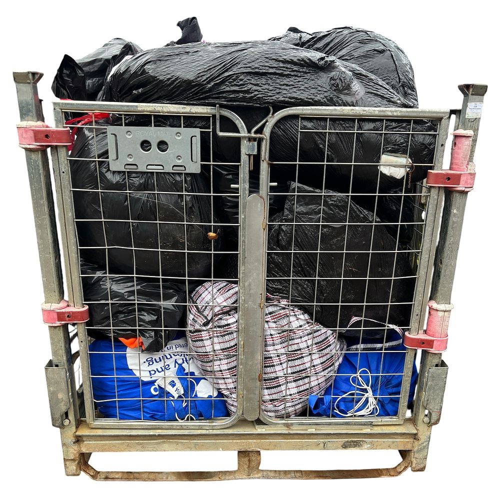 Lot 100: * A cage containing assorted clothing and footwear - CAGE NOT INCLUDED