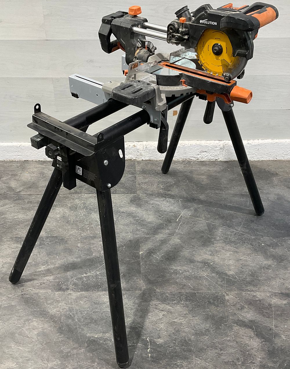 Lot 28: * Evolution 064-0001 18V Cordless Sliding Mitre Saw on Folding Stand