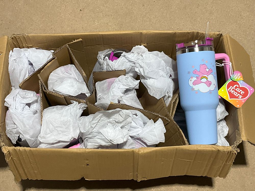 Lot 72: A Carton Containing 12- Care Bears 1200ml Multiway Travel Cups